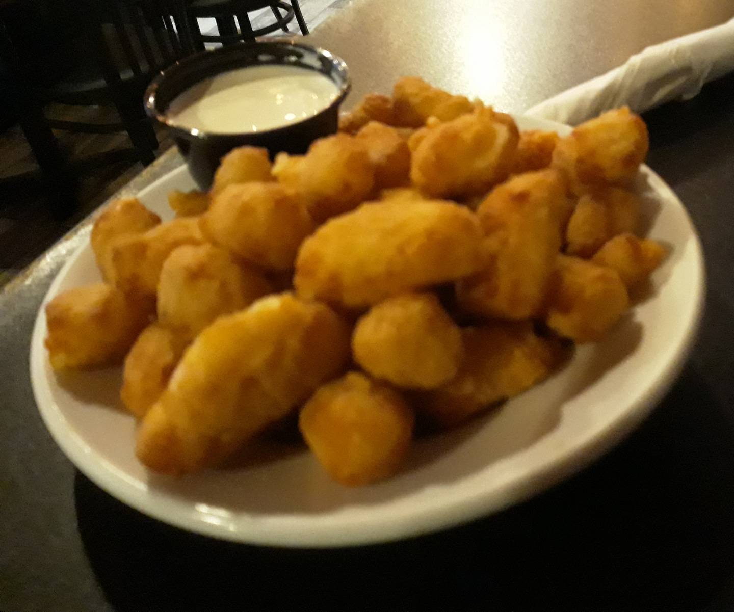 Riverfront Bar and Grill offers cheese curds on its appetizer menu, offering them in regular and garlic flavors.