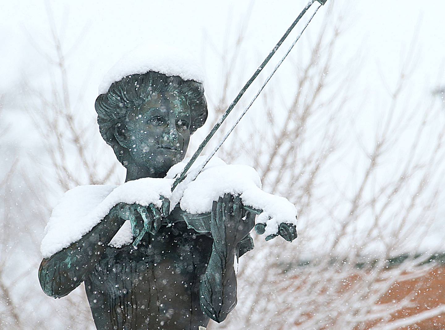 Heavy snow falls down on the Maud Powell Statue on Wednesday, Jan. 25, 2023 in Peru.