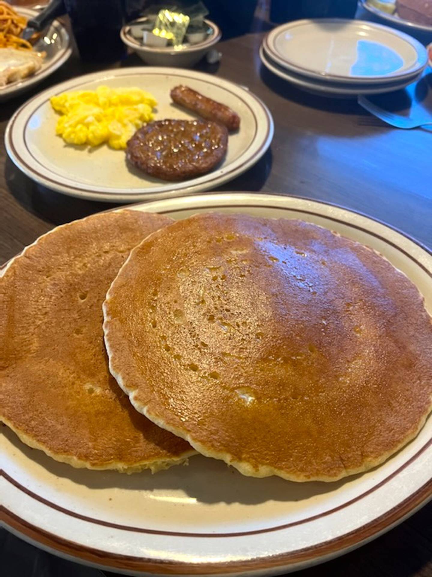 The Papa at the Coffee Cup includes two eggs any style, two pieces of breakfast meat and two large, fluffy pancakes.