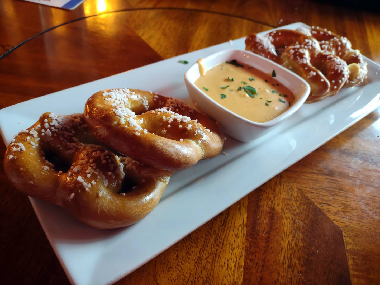 The pretzel and beer cheese appetizer can easily be divided between two or four diners at Tully Monster Pub & Grill in Morris. Bites of the soft pretzel include a crunch of salt and velvety cheese for dipping.