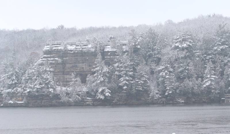 Eagle Cliff at Starved Rock State Park is covered in snow across from the Starved Rock Lock and Dam on Wednesday, Jan. 25, 2023 in Utica.