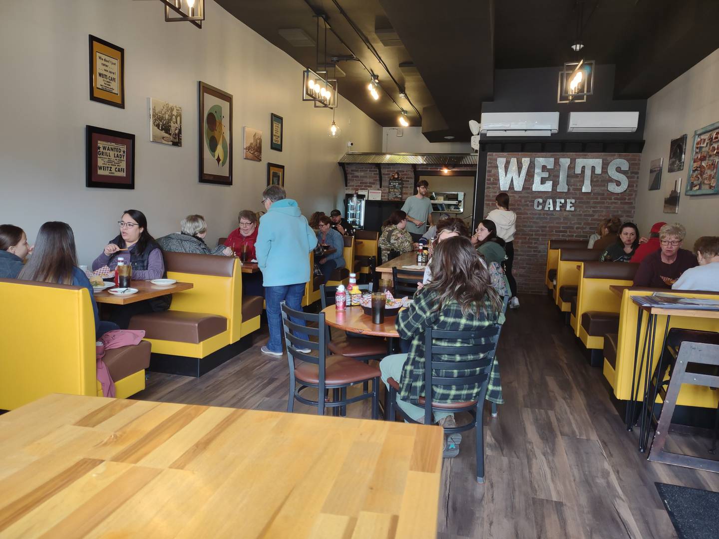 Diners sit at booths and tables and socialize at Weits Cafe in Morris.