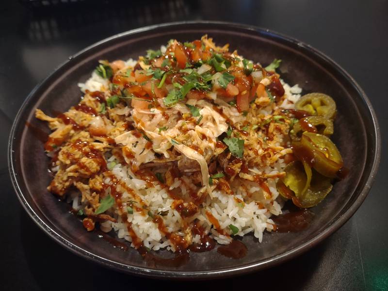 The barbecue pork bowl at Brennan's Bar and Grill in Oglesby has pulled pork over cilantro lime rice and includes spicy slaw, pico, jalapenos, cilantro, barbecue sauce and avocado.