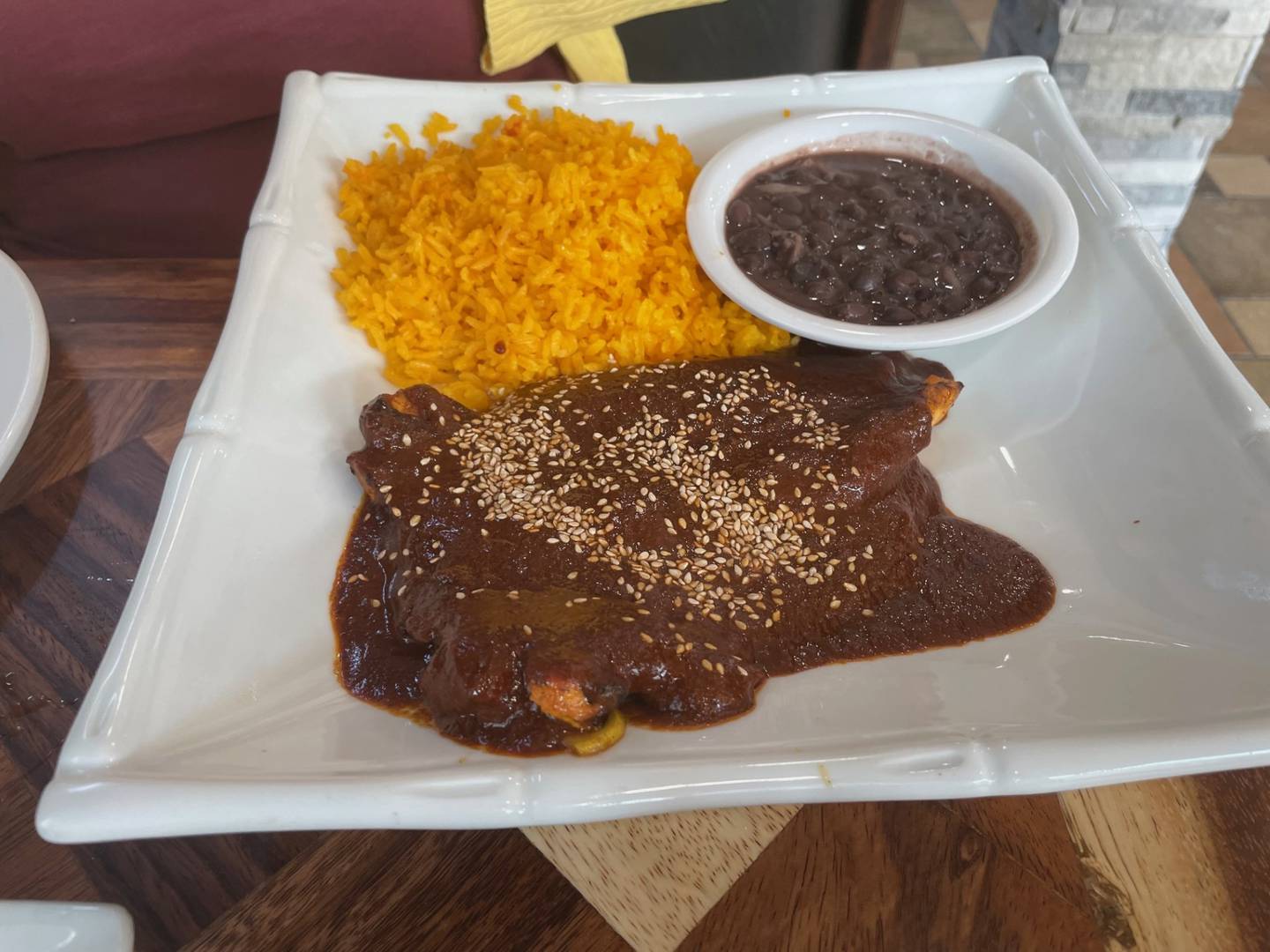 Chicken breast in mole sauce with rice and black beans, one of the entrees available at Blue Margaritas in Oglesby. The people who converted the former KFC/Taco Bell into a sit-down restaurant put as much care into the plating as in the lush decor.