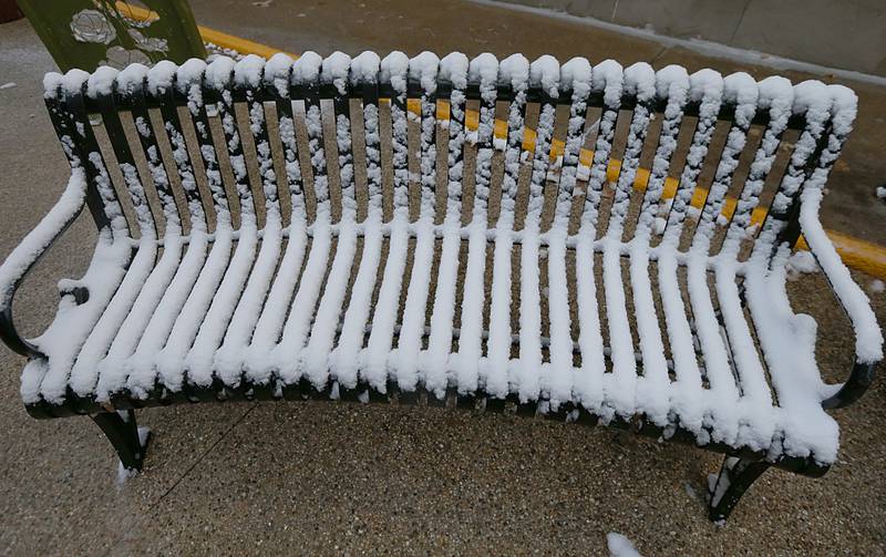 Snow covers a bench at the Lovejoy Way monument on Tuesday, Nov. 15, 2022 in Princeton.