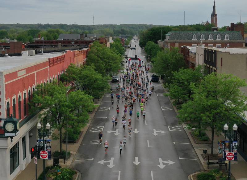 Runners race down La Salle Street to begin the the 2022 Starved Rock Country Marathon on Saturday, May 14, 2022, in downtown Ottawa.