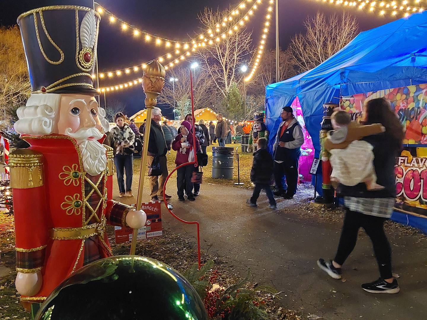 Shoppers make their way around the Chris Kringle Market on Friday, Dec. 15, 2023, in the Jordan block in Ottawa. Saturday and Sunday are the final days of the market.