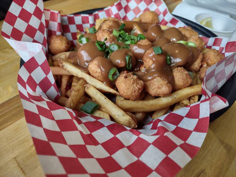 An appetizer order of poutine at Weits Cafe in Morris. Poutine is a dish from Quebec featuring french fries and cheese curds topped with gravy. Weits also tops the poutine with green onion.