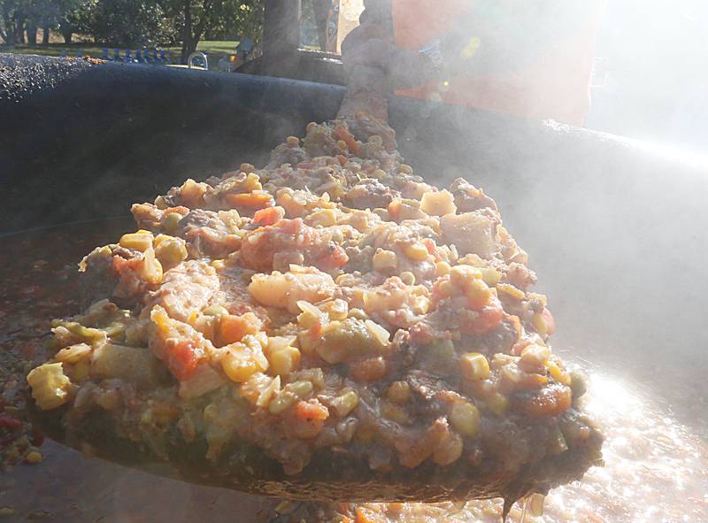 A view of the Burgoo stew as it is stirred in a kettle during the 52nd annual Burgoo on Sunday, Oct. 9, 2022. More than 350 pounds of onions, celery, potatoes, carrots and other vegetables are made into the famous stew.