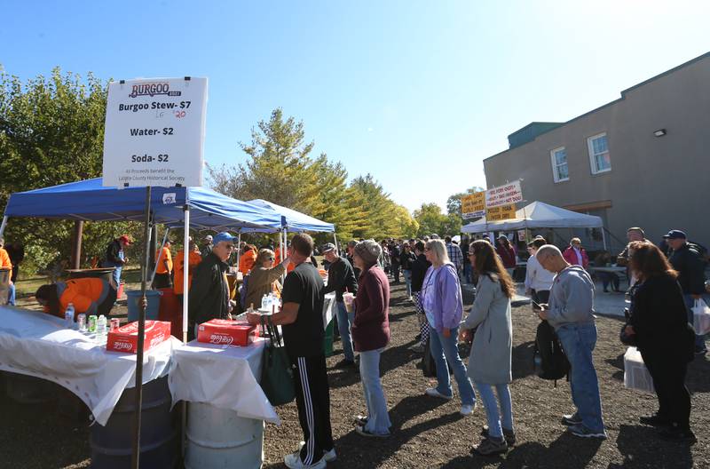 A long line of people begins to form at the Burgoo booth during the 52nd annual Burgoo on Sunday, Oct. 9, 2022.