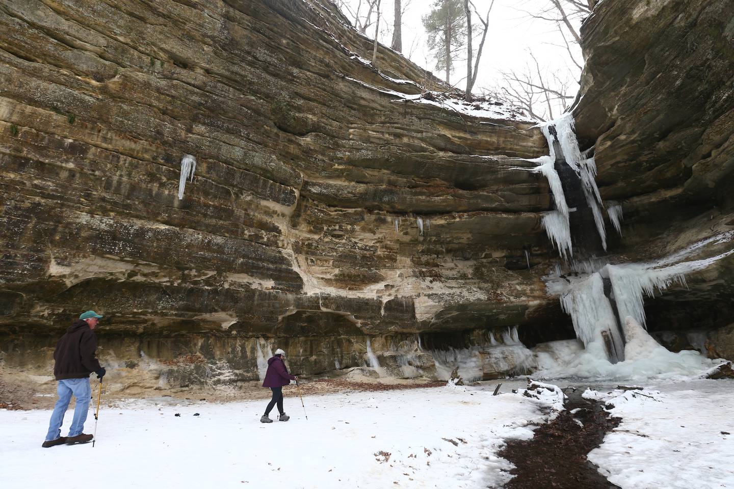 Gregg and Sue Flaherty, of Peru, take a winter hike to St. Louis Canyon at Starved Rock State Park on Wednesday Jan. 13. Some of the waterfalls in the canyons are beginning to freeze.