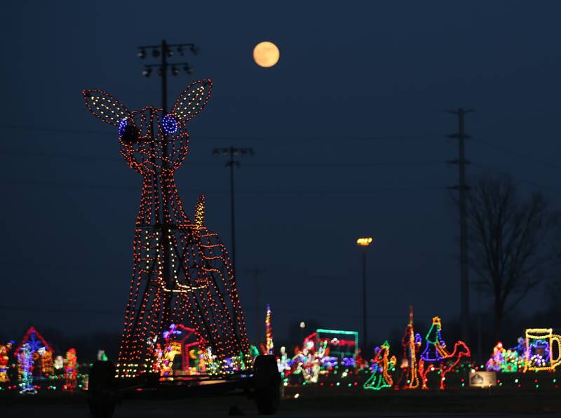 A full moon rises over Rudolph during the Celebration of Lights on Thursday, Dec. 8, 2022 at Rotary Park in La Salle.
