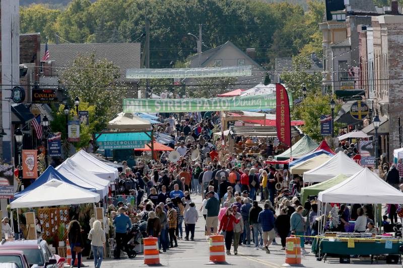 A large crowd gathers on Mill Street for the 52nd annual Burgoo festival on Sunday, Oct. 9, 2022 in Utica.
