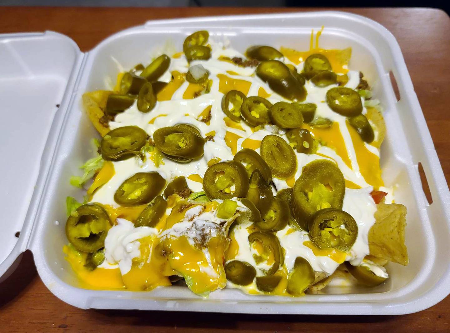 Ziggy's Bar & Grill in Marseilles offers both dine-in and carryout. This carryout appetizer of loaded nachos – which includes ground beef, cheese sauce, onion, lettuce, tomato and the optional addition of jalapenos – is large enough to serve as an entree.