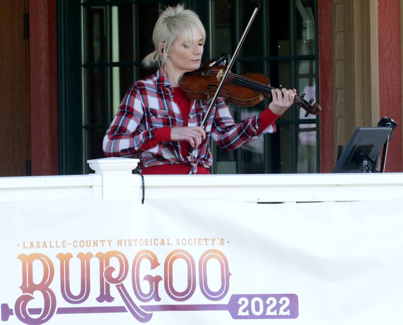 Violinist Casey McGrath plays the violin during the 52nd annual Burgoo Festival on the front porch of the La Salle County Historical Society on Sunday, Oct. 9, 2022 in Utica.