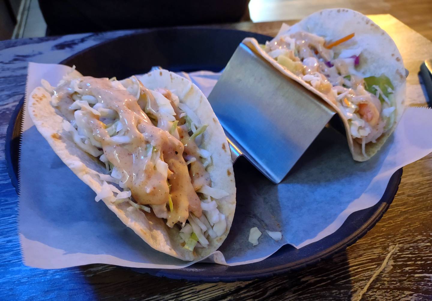 Two tacos are sold a la carte on the menu at Ziggy's Bar & Grill in downtown Marseilles. The fish taco has breaded alaskan pollock and a choice of ranch or Ziggy slaw. The shrimp taco features shrimp and Ziggy slaw.