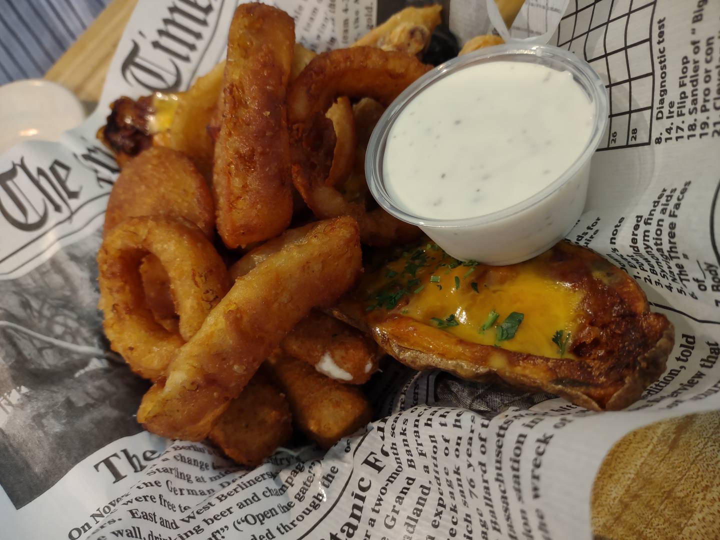 The Maria's basket appetizer includes two potato skins, four chicken wings, four mozzarella sticks and a handful of onion rings.