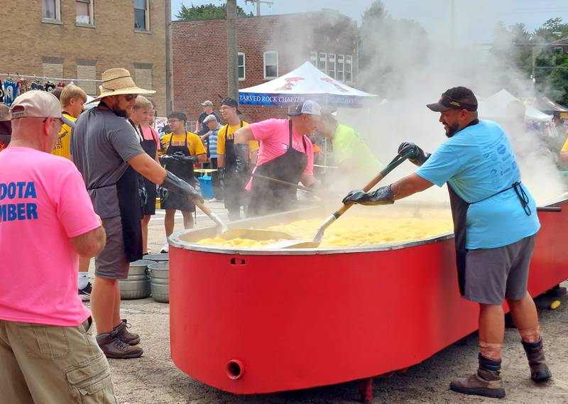 Sweet corn is boiled Sunday, Aug. 13, 2023, at the Mendota Sweet Corn Festival prior to it being distributed for free to visitors.