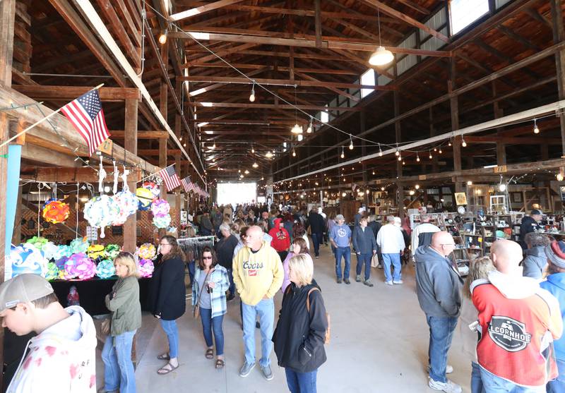 A large crowd gathers inside the La Salle County Historical Society barn for the 52nd annual Burgoo festival on Sunday, Oct. 9, 2022 in Utica.