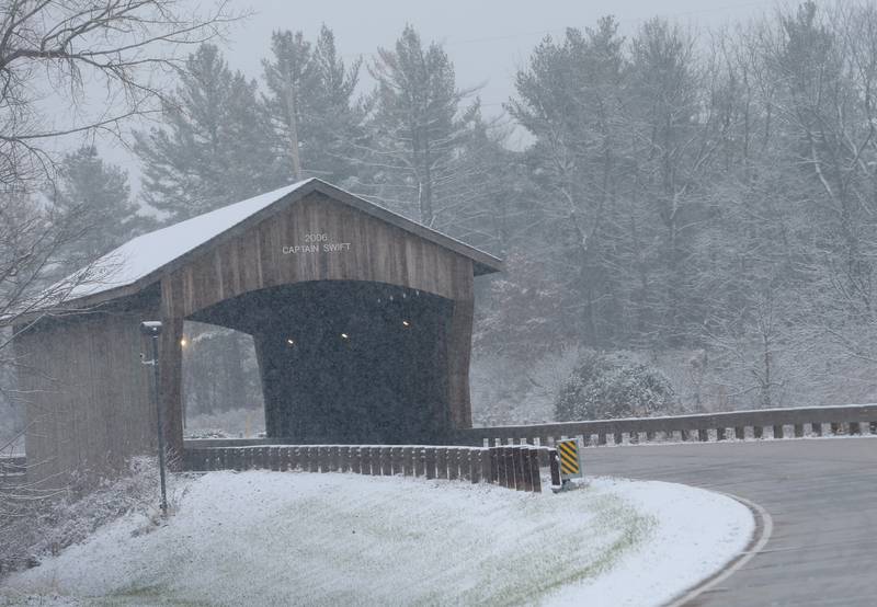 Snow falls steady at the covered Captain Swift Bridge on Tuesday, Nov. 15, 2022 in Princeton.