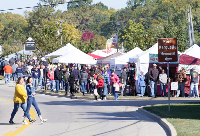 A large crowd gathers for the 52nd annual Burgoo festival on Sunday, Oct. 9, 2022 in Utica.