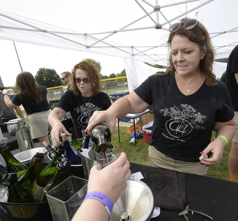Tylene Lewis, of August Hill Winery, was busy pouring samples Saturday, Sept. 17, 2022, during the Vintage Wine Fest in Utica. The festival returned to Utica at Carey Memorial Park. Wineries from throughout the Midwest participated.