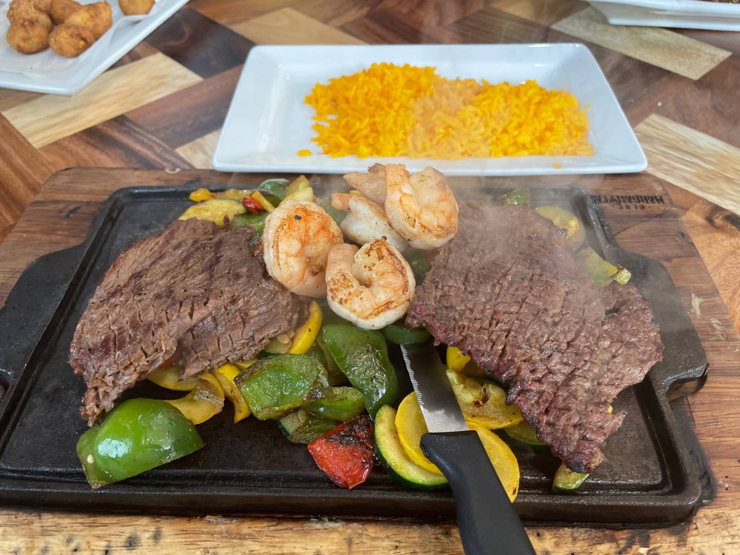 Steak mar y tierra is a Mexican surf-and-turf combo available at Blue Margaritas in Oglesby. Be warned: That skillet is HOT and should be kept at arm's length from the little ones.